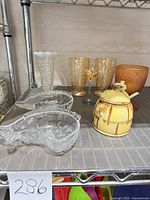 All 8 items grouped on shelf showing relative sizes and colors