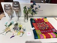 Full lot overview: two goblets, vase with berry stem, bundle of faux florals, embroidered textile