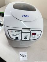 Front three-quarter view of Oster 5838 bread machine showing overall condition