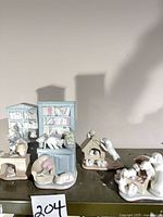 Group view of all four porcelain animal figurines