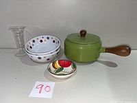 All items grouped: fondue pot, lid, two polka-dot bowls, apple dish, glass beaker