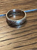 Ring lying flat showing exterior engraving