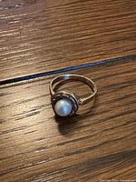 Top view of gold ring with pearl