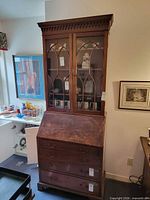 Full view of wooden secretary hutch