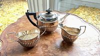 Birks sterling teapot, creamer and sugar on table
