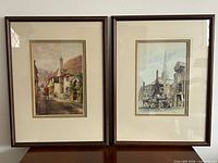 Both framed prints side by side