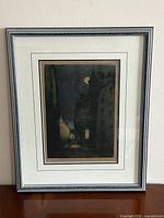 Front view of framed signed etching