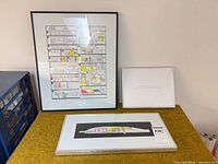 Three framed glider related prints grouped together