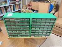 Front view of two green metal organizers with drawers