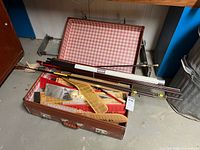 open suitcase showing glider parts
