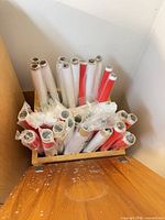 View of micafilm rolls stored inside wooden cabinet