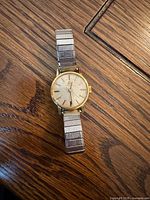 Full view of Omega ladies wristwatch on wooden surface