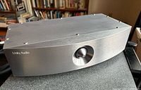 Front view of Unity Audio crossover showing brushed aluminum finish and brand name