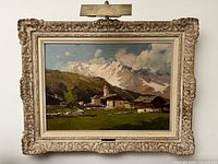 Framed landscape painting with picture light