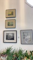 All four framed artworks on wall showing relative arrangement and scale
