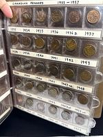 Album page showing 1933-1957 labeled coins