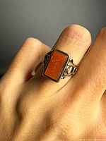 Ring worn on finger showing rectangular agate face