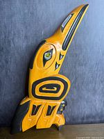 Full view of carved cedar raven plaque upright