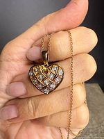 Close-up of heart pendant showing diamond lattice detail