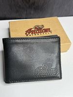 Front of black leather wallet showing embossed Indian Motorcycle logo and branded box