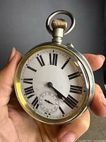 Front view showing dial, numerals and hands