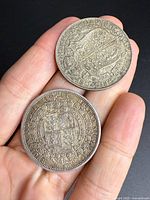 Two British half crown coins showing reverse shield designs and dates 1887 and 1921