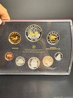 Front view of eight-coin proof set in case