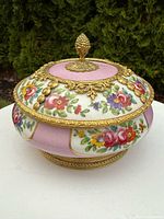 Side view of Sevres porcelain bowl with lid showing floral decoration and gilt bronze mounts