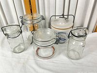 Group shot of five lidded containers