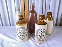 Front group view of all five bottles showing markings and colors