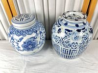Ginger jar and wine pot side by side showing overall form and decoration