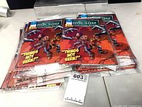 Stack of bagged Welcome to Holsom Population: Weird Issue 1 comics