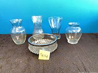 Group view of four vases and pressed-glass bowl