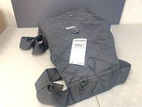 Full view of folded black quilted Playtex hip hammock carrier