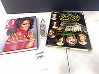 Two books and plaque showing overall lot contents