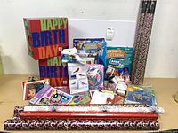 Group shot showing gift-wrap rolls, gift boxes, craft items and accessories