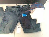 Cap, jeans and socks arranged together