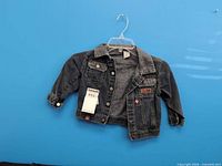 Front view of Levi's child denim jacket on hanger