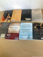 Back covers of eight books laid out