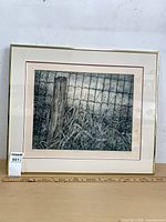 Front view of framed print showing artwork, mat, and brass frame