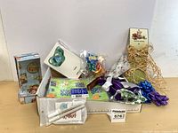 Group shot of entire lot showing tissue, ribbons, bows, markers, box