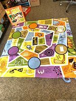 Folded Jabber Mat floor game laid out showing colorful design
