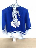 Front view jersey hanging, laces draped