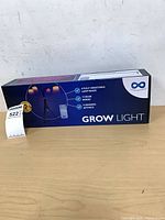 Front of retail box showing grow light image and features
