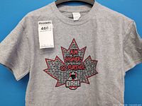 Front view of grey T-shirt with maple-leaf graphic and ORHL logo
