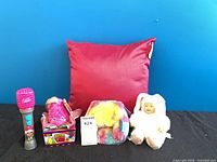 Full lot view with pillow, microphone, plush toys, baby doll