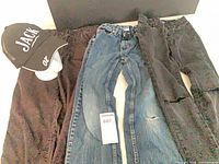 Overall view of three pants and cap