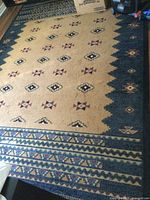 Full view of area rug showing overall pattern and colors