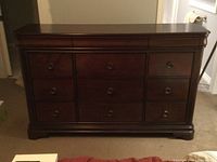Front view of nine-drawer dresser