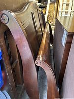 Headboard, footboard and side rails stacked in storage